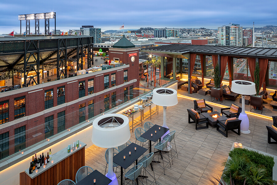 A boutique hotel rooftop bar with a stunning view of the city.